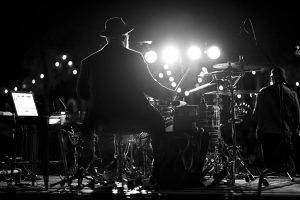 View of the back of a Drummer on stage